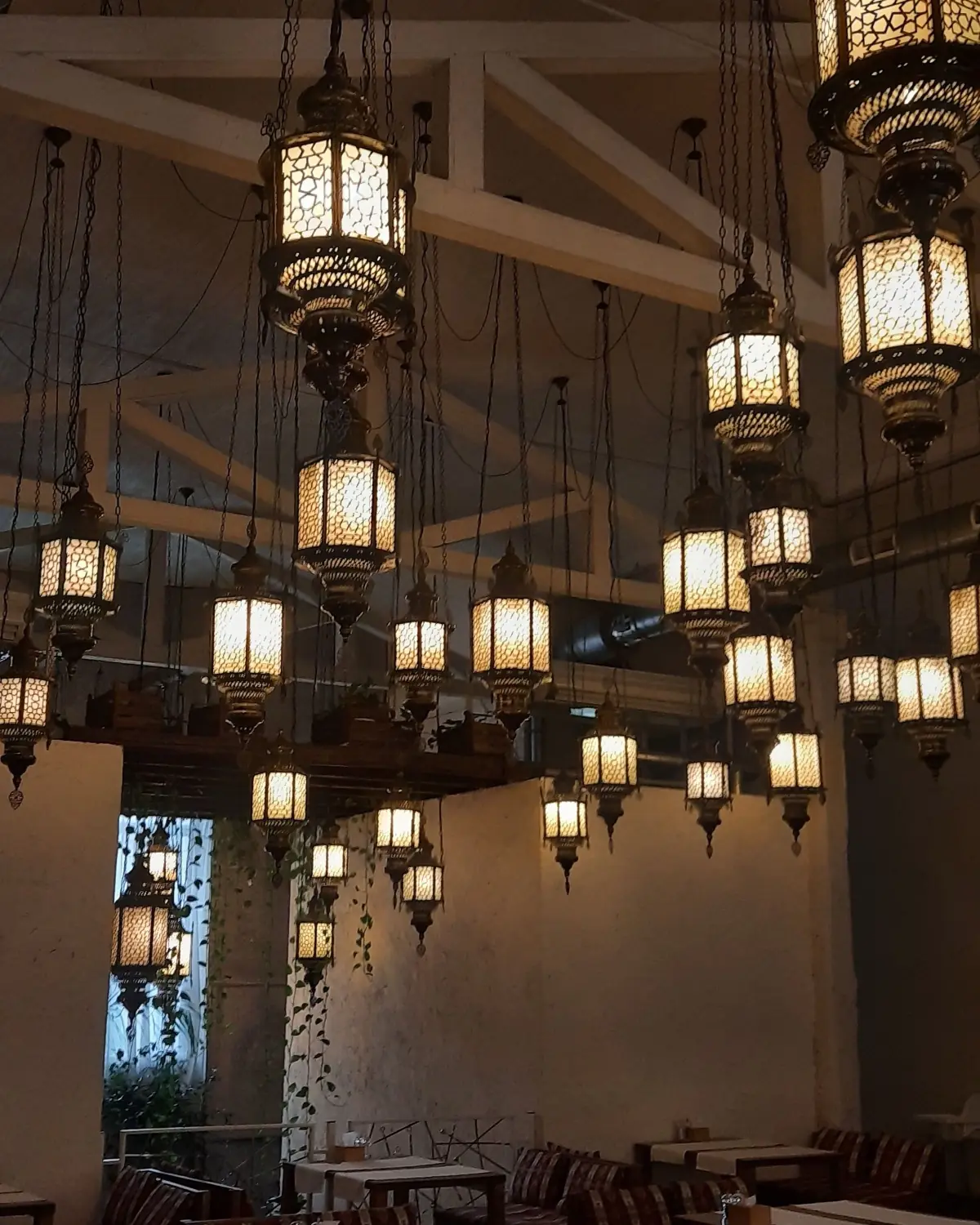 The dining room under hanging lanterns