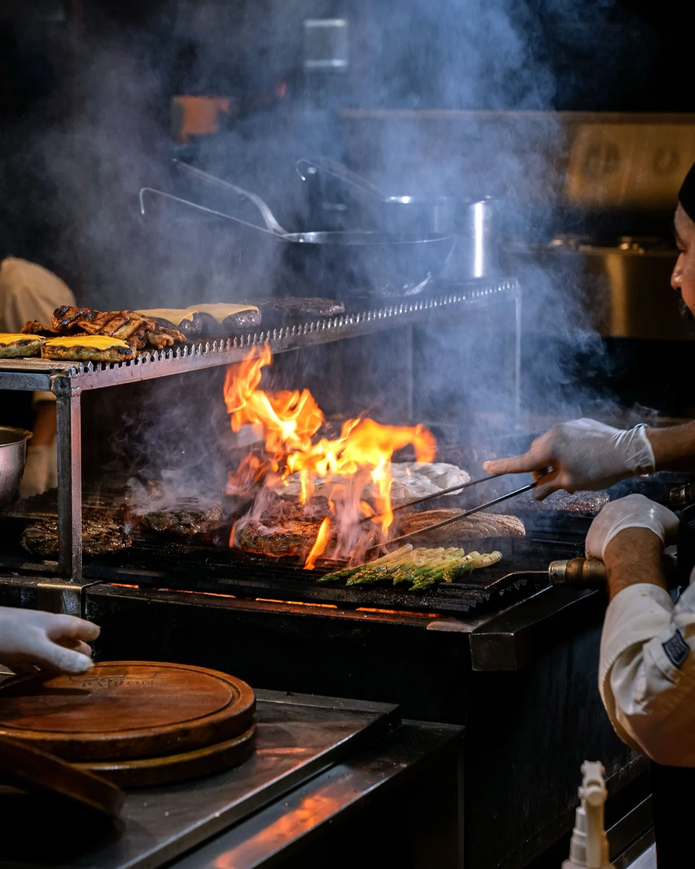 The grill master working over the flame